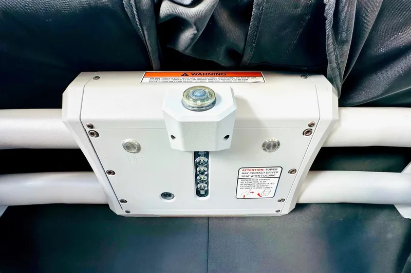 Slide: The Image of 2020 Supra SE550 boat component with warning labels and metal fittings. - 27