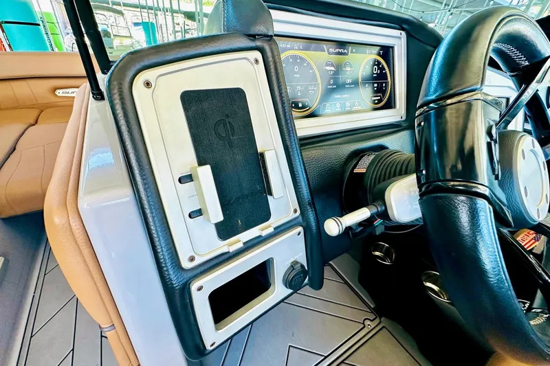 Slide: The Image of 2020 Supra SE550 dashboard with steering wheel and digital display. - 33