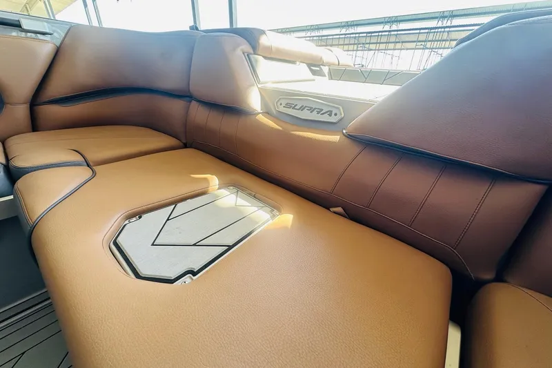 Slide: The Image of 2020 Supra SE550 interior with luxurious brown leather seating and stylish design. - 34