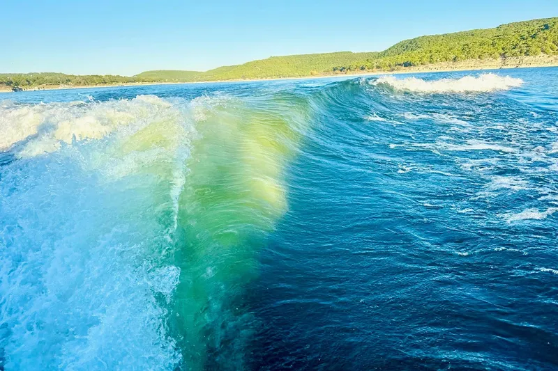 Slide: The Image of Wave created by 2020 Supra SE550 boat on a sunny lake. - 38