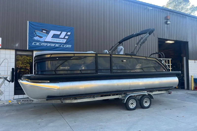 The Image of 2026 Godfrey Monaco 235 SFL pontoon boat on trailer at CIC Marine facility. - 1