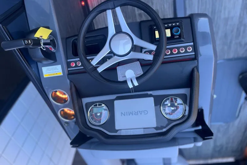 Slide: The Image of Steering console of 2026 Godfrey Monaco 235 SFL with Garmin navigation system. - 18