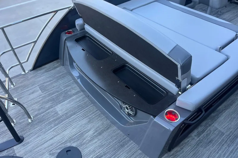 Slide: The Image of 2026 Godfrey Monaco 235 SFL boat interior with seating and storage compartments. - 24