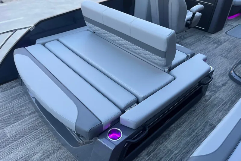 Slide: The Image of Luxurious seating on 2026 Godfrey Monaco 235 SFL boat with modern design and cup holders. - 29