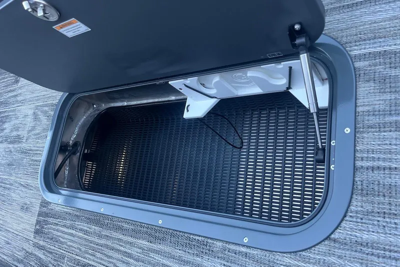 Slide: The Image of Open storage compartment on 2026 Godfrey Monaco 235 SFL boat, featuring a durable interior. - 31