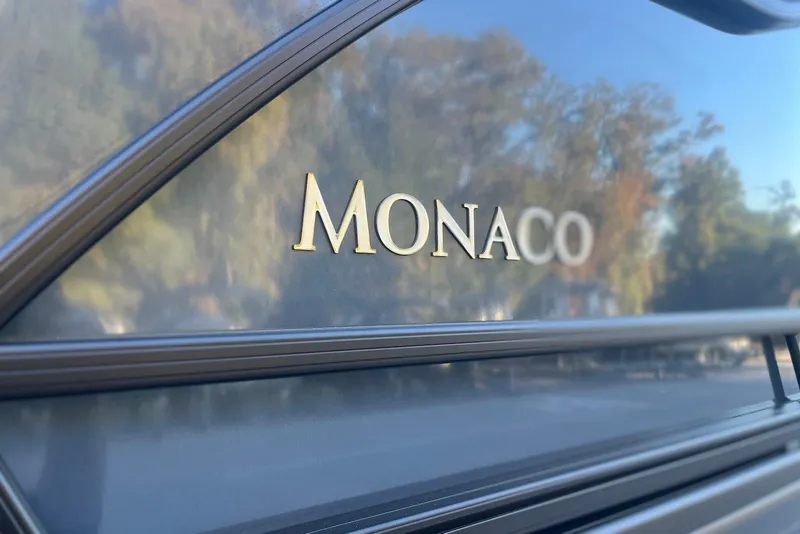 Slide: The Image of Close-up of 2026 Godfrey Monaco 235 SFL logo on sleek exterior. - 35