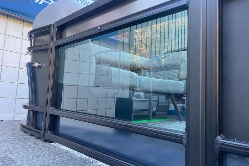 Slide: The Image of 2026 Godfrey Monaco 235 SFL pontoon boat with sleek glass panel and luxurious seating. - 6