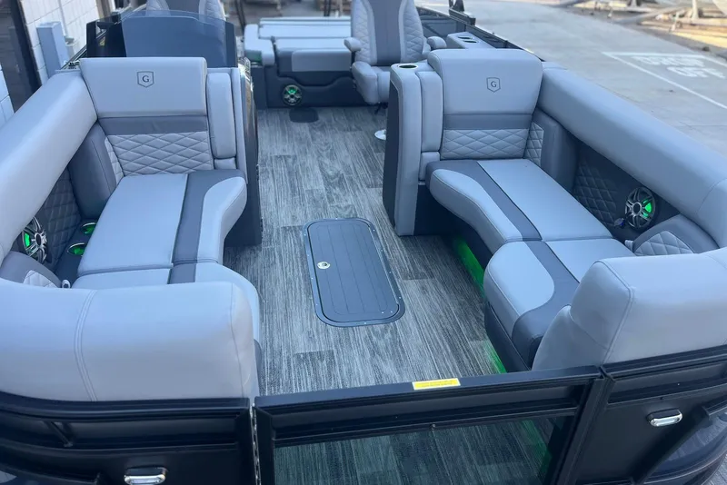 Slide: The Image of 2026 Godfrey Monaco 235 SFL pontoon boat interior with luxurious gray seating and modern design. - 7