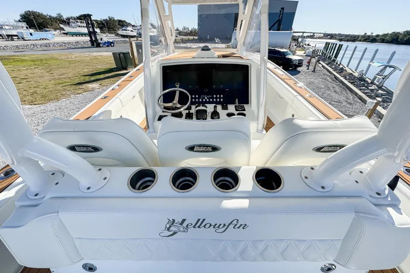 Slide: The Image of 2012 Yellowfin 39 Offshore boat cockpit with steering wheel and control panel. - 4