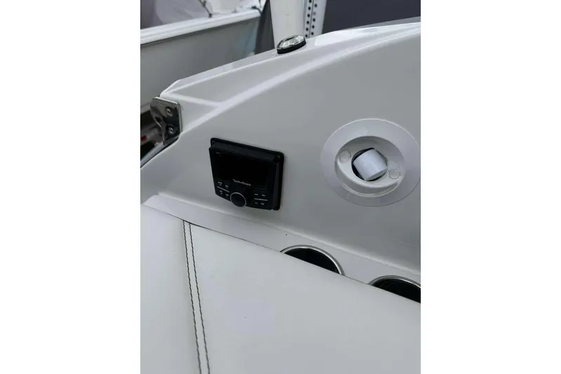 Slide: The Image of 2021 Cobalt R6 boat interior with control panel and cup holders. - 6