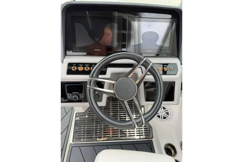 Slide: The Image of 2021 Cobalt R6 boat dashboard with steering wheel and dual Garmin displays. - 7