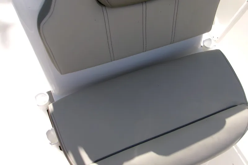 Slide: The Image of 2024 Key West 1720 Center Console boat seat detail, featuring gray upholstery. - 12