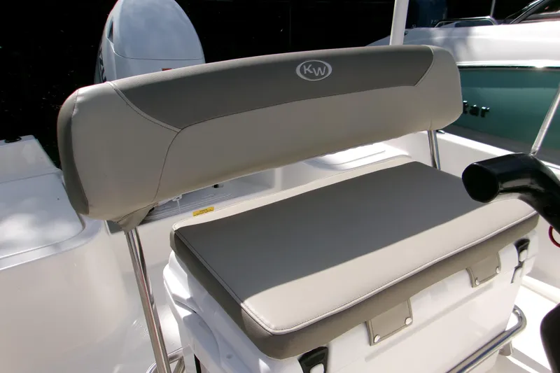 Slide: The Image of 2024 Key West 1720 Center Console boat seat with gray upholstery and KW logo. - 14