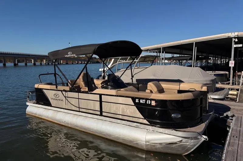 The Image of 2023 Veranda Relax VR22RC pontoon boat docked on a sunny day. - 0