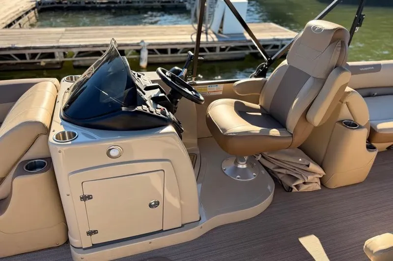 Slide: The Image of 2023 Veranda Relax VR22RC boat interior with captain's chair and control console. - 4