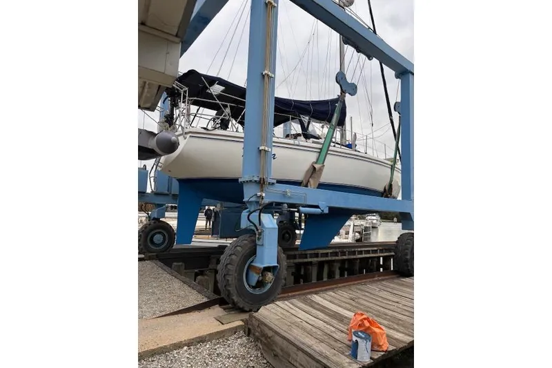 The Image of 1986 Catalina 36 sailboat docked at marina during sunset. - 0