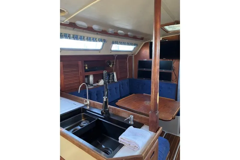 Slide: The Image of Catalina 36 MK I sailboat from 1986 on a lift at a marina. - 12