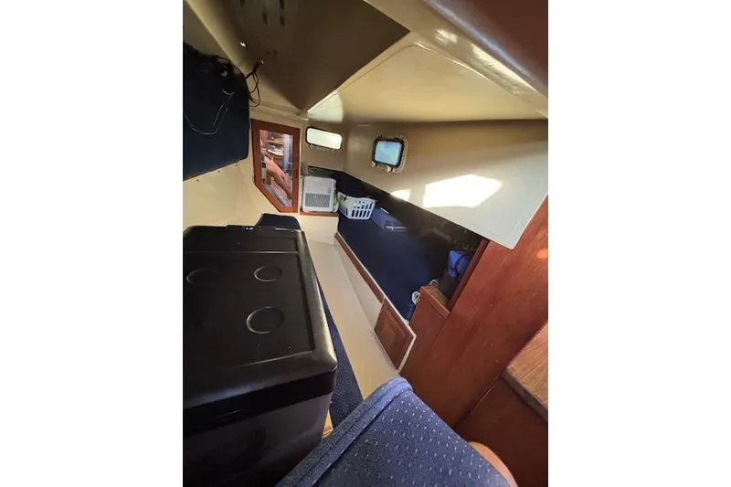 Slide: The Image of 1986 Catalina 36 MK I yacht kitchen with wooden flooring and modern appliances. - 17