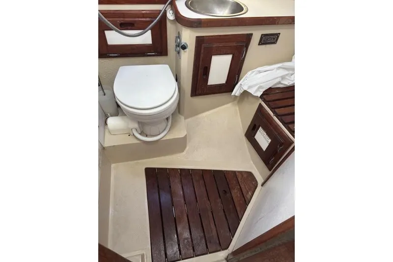 Slide: The Image of Interior of 1986 Catalina 36 MK I sailboat with cozy seating and wooden finishes. - 20
