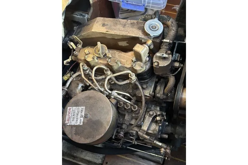 Slide: The Image of Interior storage space on a 1986 Catalina 36 sailboat with wooden paneling and organized items. - 34