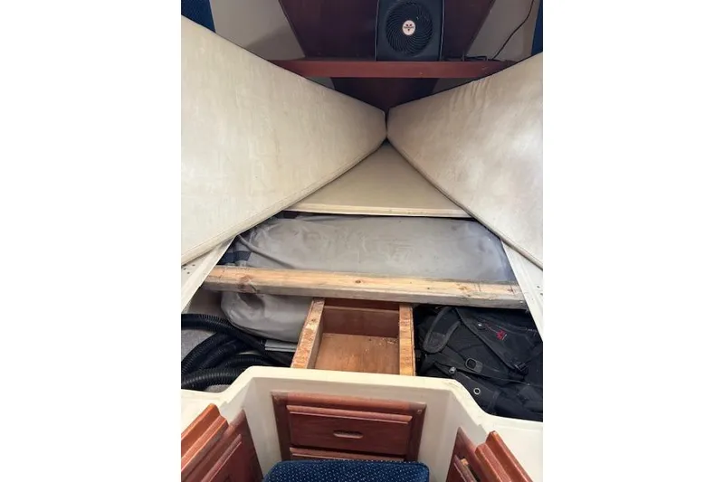 Slide: The Image of Interior cabin view of a 1986 Catalina 36 sailboat, featuring storage compartments. - 37