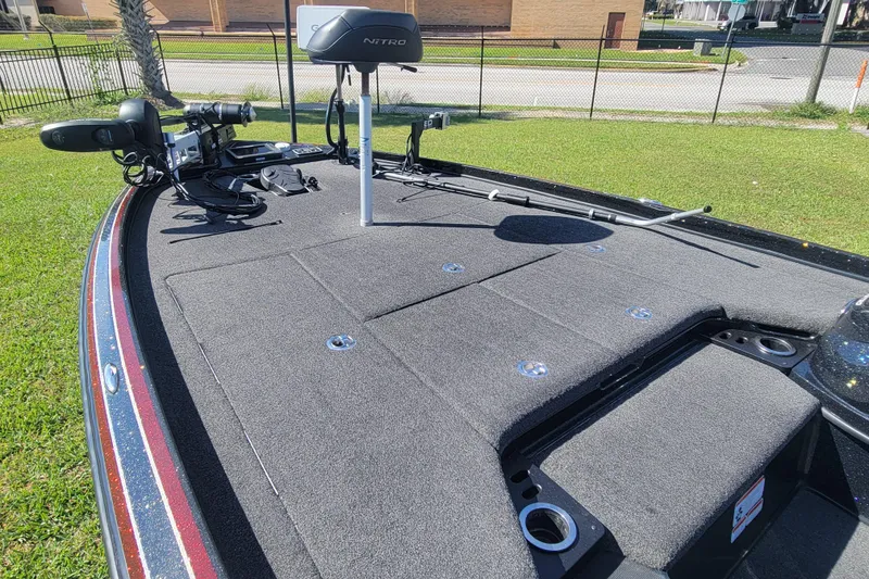 Slide: The Image of 2017 Nitro Z21 Pro boat deck with fishing equipment and trolling motor. - 11