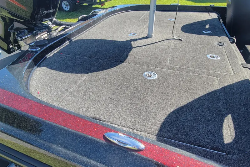 Slide: The Image of 2017 Nitro Z21 Pro boat deck with carpeted surface and storage compartments. - 19