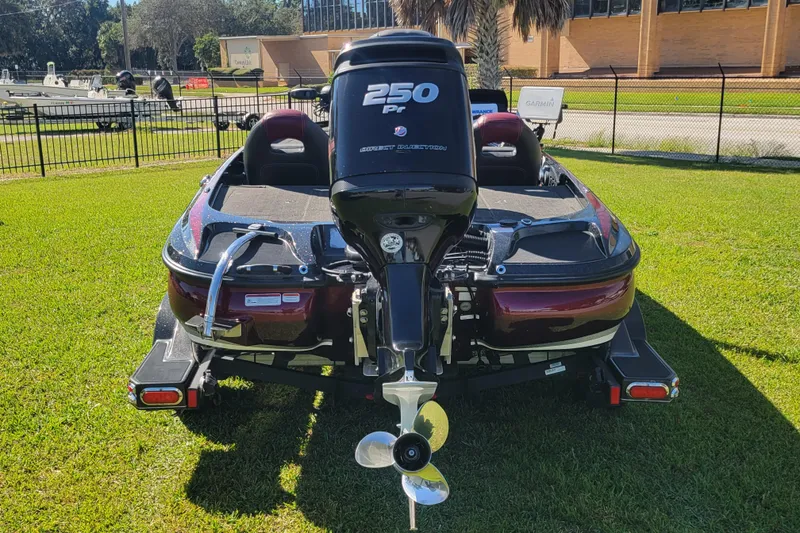 Slide: The Image of 2017 Nitro Z21 Pro boat with powerful 250 HP engine on grassy area. - 6