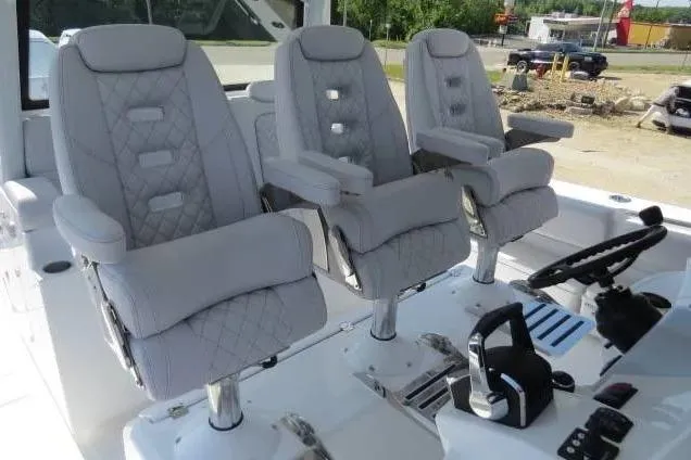 Slide: The Image of Luxury seating on 2024 HCB 53 Suenos RXV boat, featuring plush, quilted design. - 12