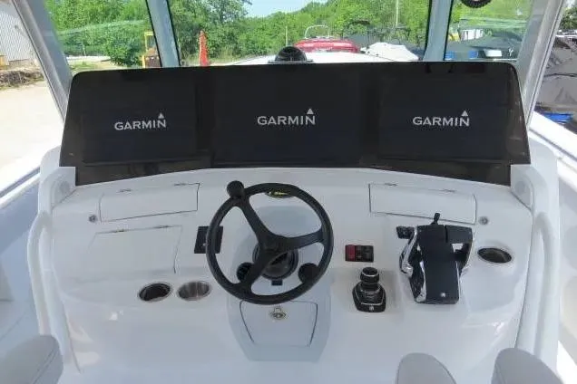 Slide: The Image of 2024 HCB 53 Suenos RXV helm with Garmin displays and steering wheel. - 15