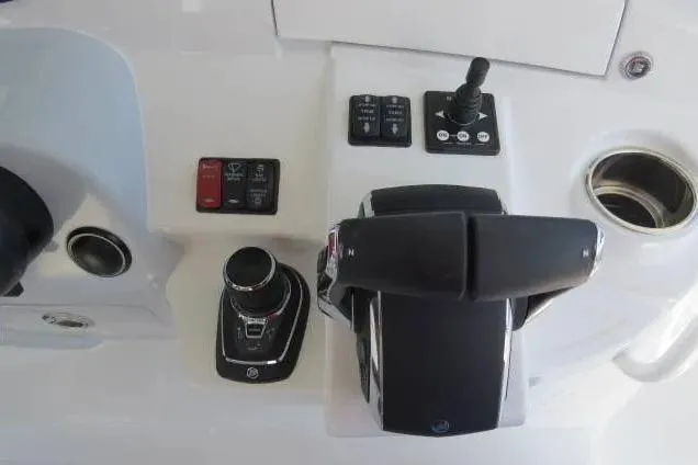 Slide: The Image of 2024 HCB 53 Suenos RXV boat controls with joystick and throttle levers. - 16