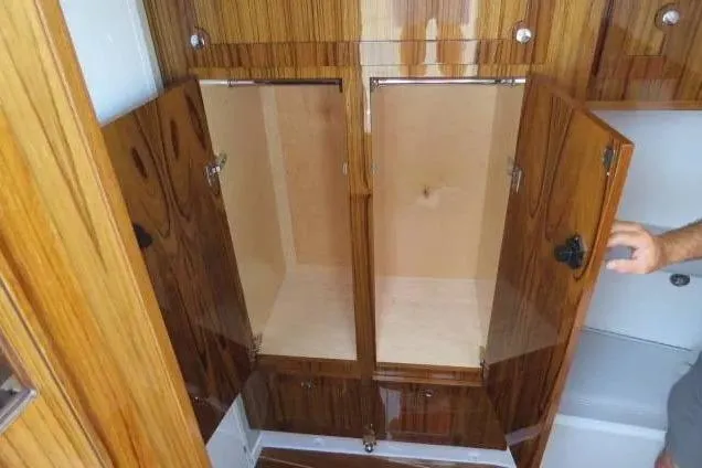 Slide: The Image of 2024 HCB 53 Suenos RXV interior with open wooden cabinets. - 28