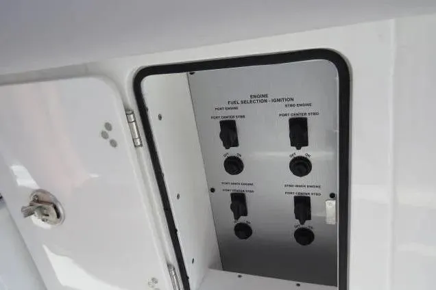 Slide: The Image of Control panel of 2024 HCB 53 Suenos RXV boat, featuring engine and fuel selection switches. - 31