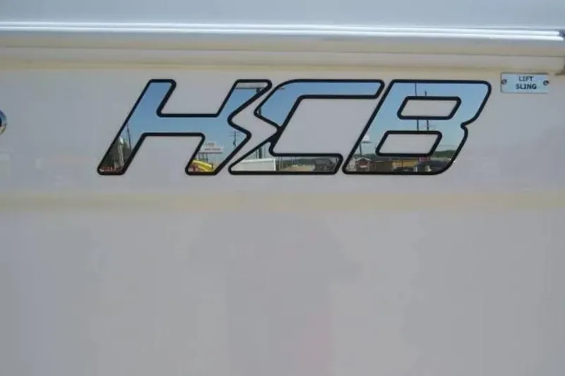 Slide: The Image of 2024 HCB 53 Suenos RXV logo on boat exterior. - 32