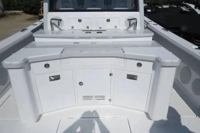 Slide: The Image of 2024 HCB 53 Suenos RXV boat interior with sleek white cabinetry and modern fixtures. - 5