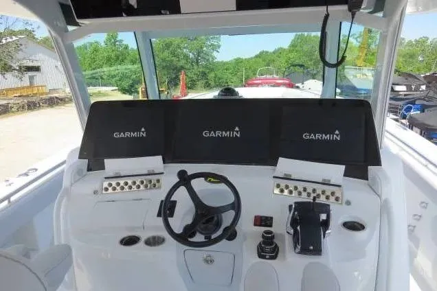 Slide: The Image of 2024 HCB 53 Suenos RXV helm with Garmin displays and steering wheel. - 13