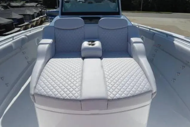 Slide: The Image of 2024 HCB 53 Suenos RXV boat with luxurious quilted seating in white. - 19