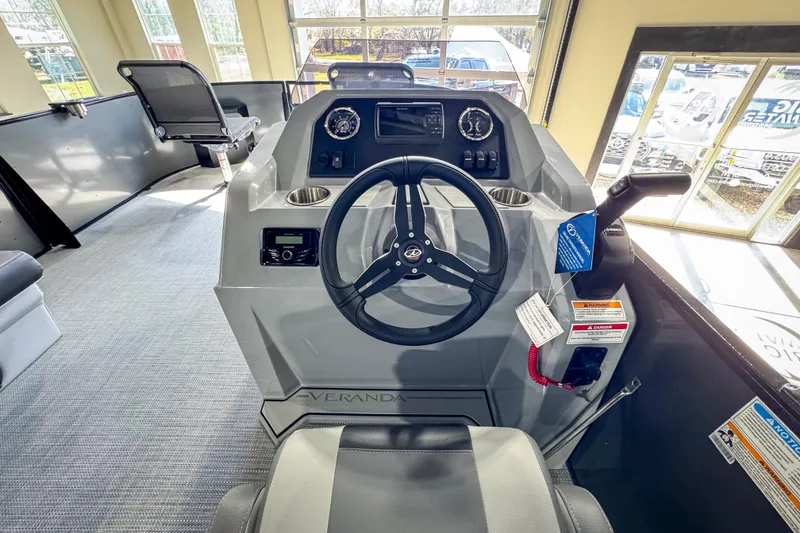 Slide: The Image of 2026 Veranda Vista 20F4 boat interior with steering wheel and control panel. - 11