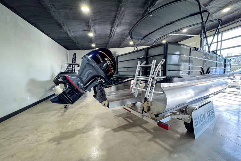 Slide: The Image of 2026 Veranda Vista 20F4 pontoon boat with Yamaha outboard motor in showroom. - 3