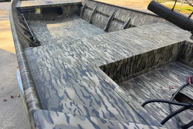 Slide: The Image of 2025 SeaArk 1648 MV Special boat with camouflage pattern interior. - 12