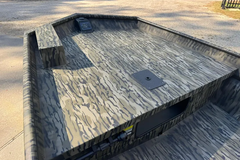 Slide: The Image of 2025 SeaArk 1648 MV Special boat with camouflage pattern, featuring a spacious deck. - 14