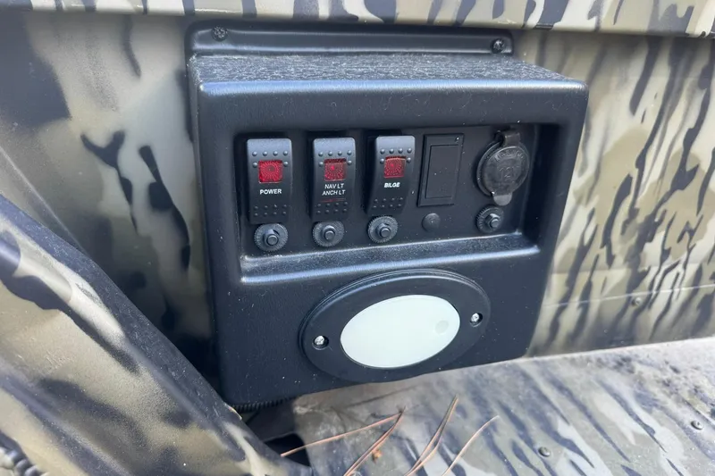 Slide: The Image of Control panel of 2025 SeaArk 1648 MV Special boat with camouflage design. - 18