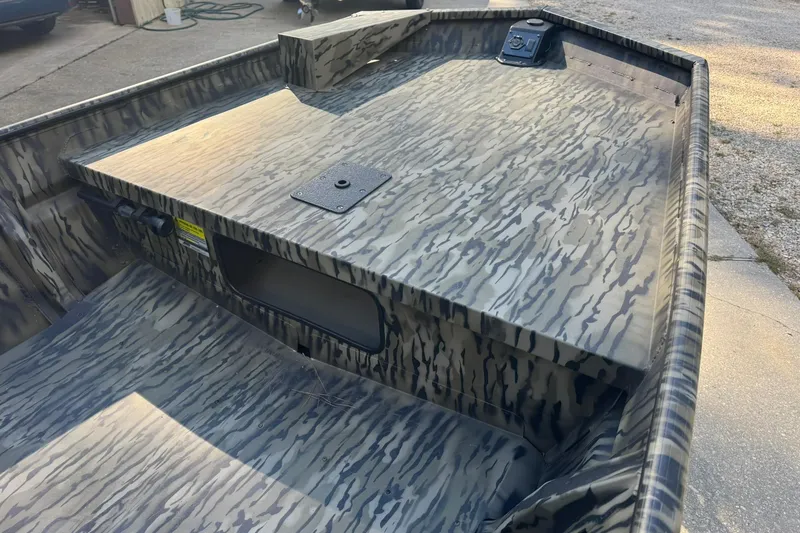 Slide: The Image of 2025 SeaArk 1648 MV Special boat with camouflage pattern, viewed from above. - 4