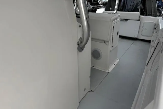 Slide: The Image of 2022 NorthCoast 230 Center Console boat interior with seating and storage compartments. - 10