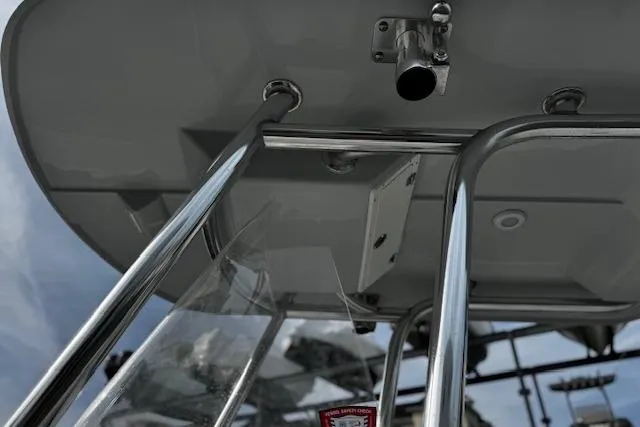 Slide: The Image of 2022 NorthCoast 230 Center Console boat, featuring stainless steel railings and canopy. - 6