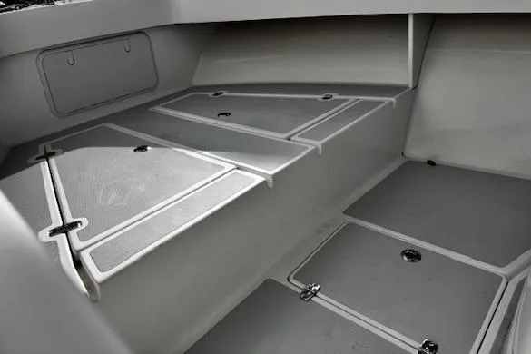 Slide: The Image of 2022 NorthCoast 230 Center Console boat interior with storage compartments. - 9
