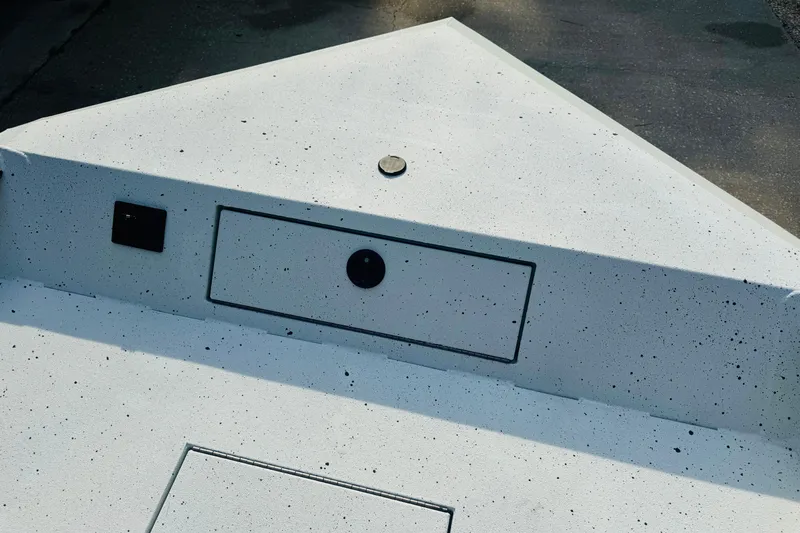 Slide: The Image of 2024 SeaArk Shadow 19 v boat deck with storage compartments and speckled finish. - 23