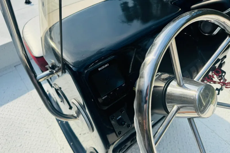 Slide: The Image of 2024 SeaArk Shadow 19 v boat steering wheel and console detail. - 26