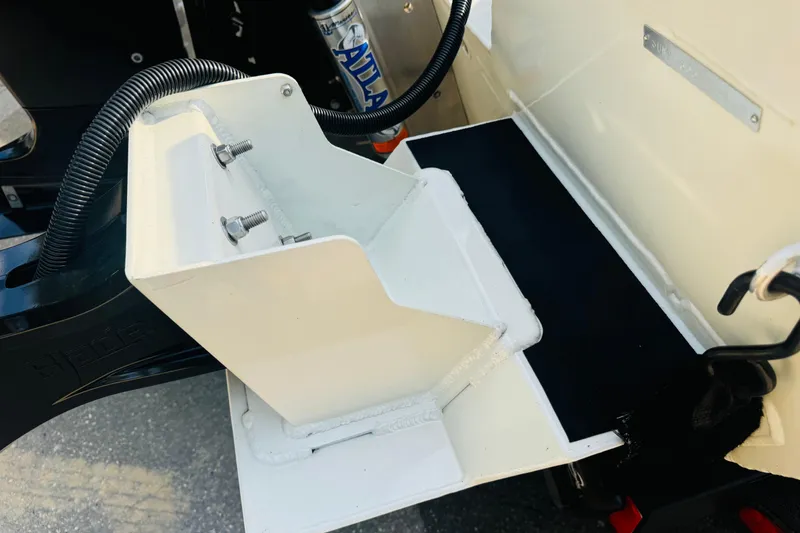 Slide: The Image of 2024 SeaArk Shadow 19 v boat detail showing mounting bracket and hydraulic system. - 32