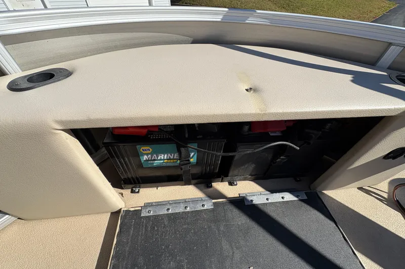 Slide: The Image of 2014 Godfrey Sweetwater 2086 F boat battery compartment with NAPA marine battery. - 10